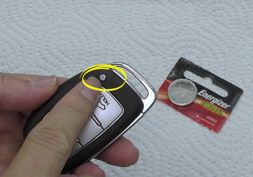 Remove key by pressing the button on the key fob